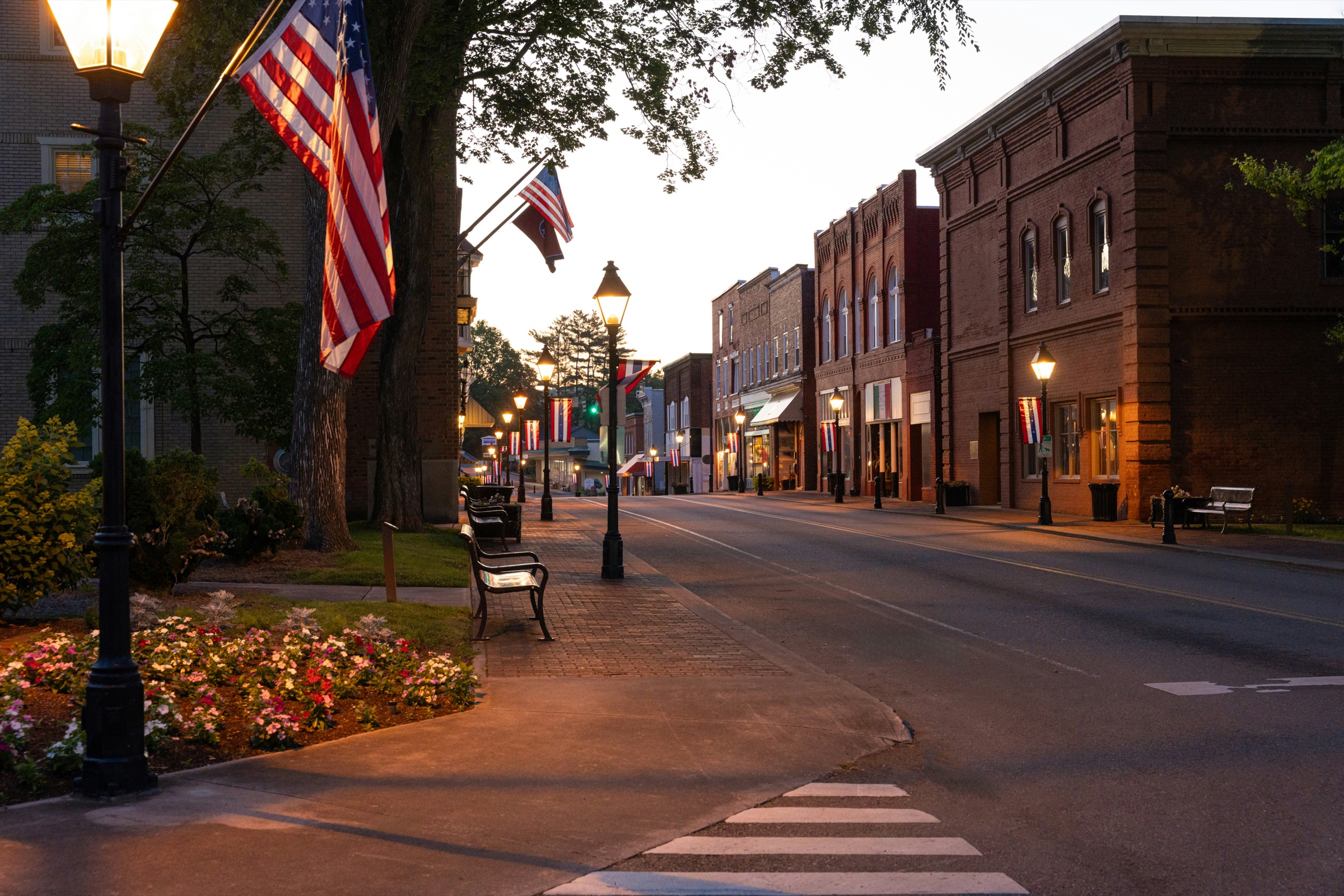 A small-town commercial main street at dusk